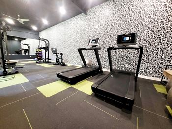 A gym with treadmills and other exercise equipment at Townhomes at 28th, Indiana, 47201